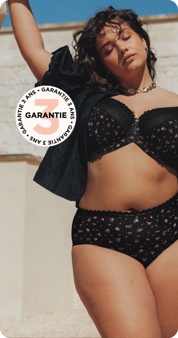 Soutien-gorge noir à motif floral coloré et détails en dentelle. Garantie 3 ans.